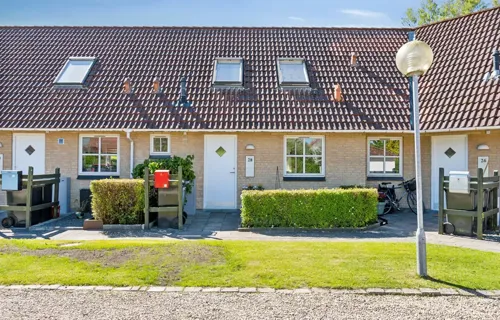 Andelsbolig i halvandet plan med egen have