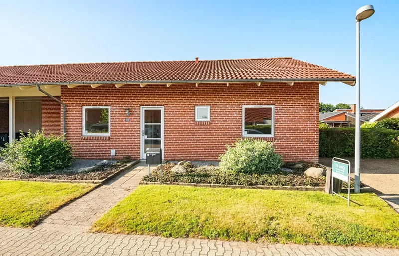 Velindrettet andelsbolig med skøn have i attraktivt kvarter i Lind